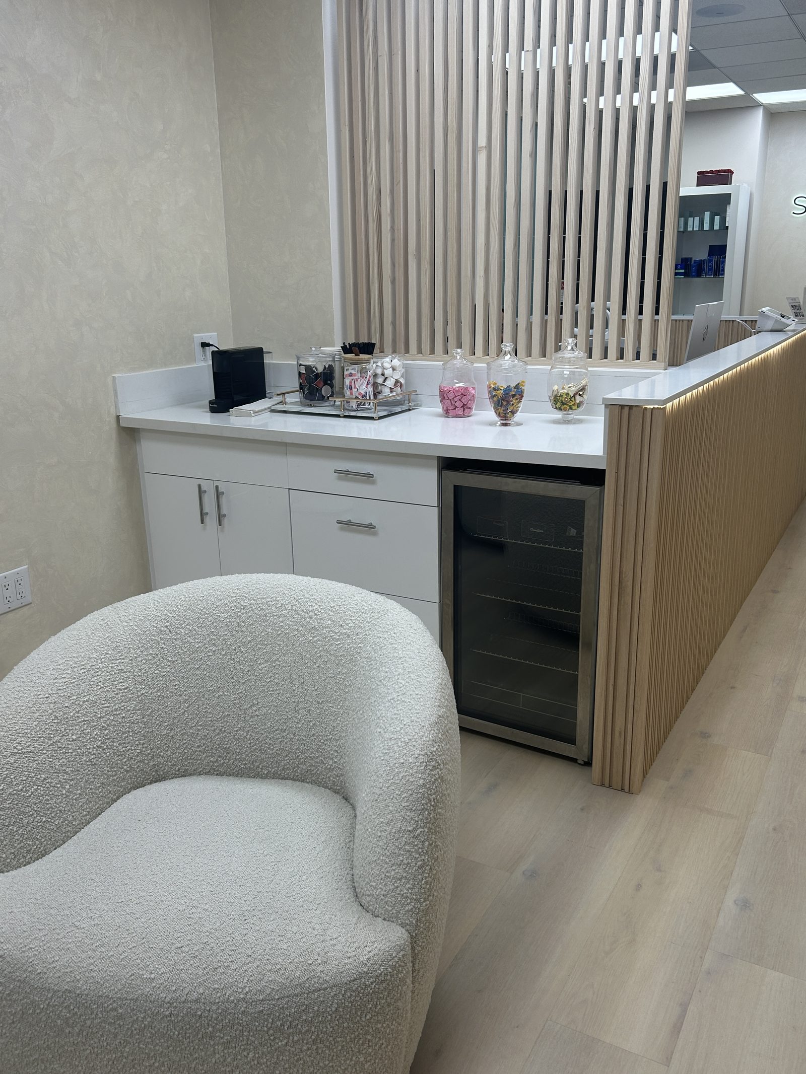 Skinsation LA entrance — brand-marked lobby that greets every appointment