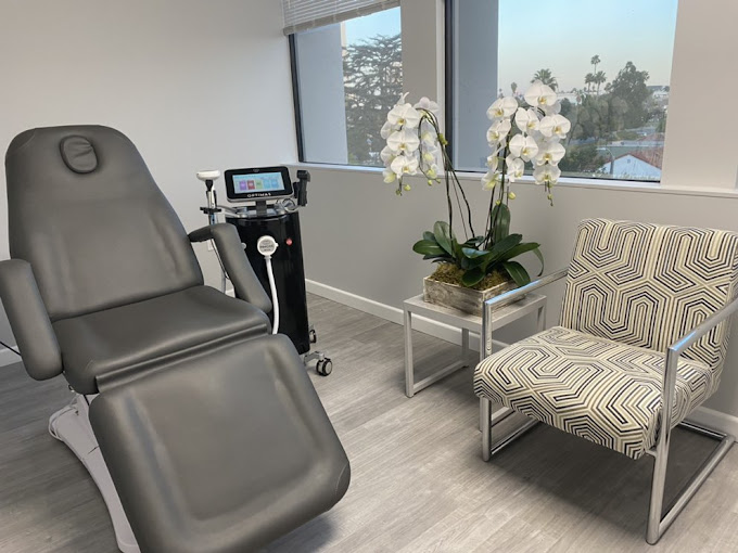 Clean and stylish interior of Skinsation LA featuring a cosmetic treatment chair and aesthetic tools