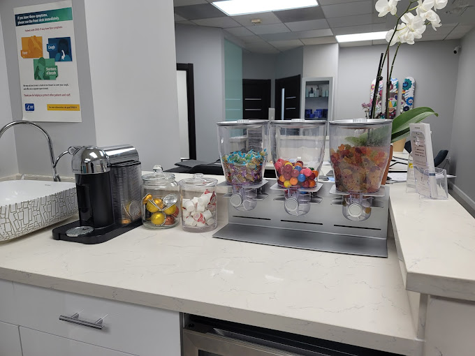 Clean and stylish interior of Skinsation LA featuring a cosmetic treatment chair and aesthetic tools